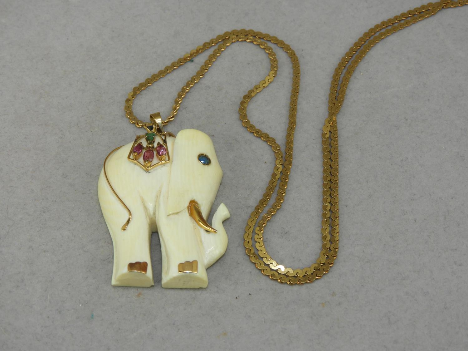 Murrays Auctioneers Lot 7 14K Ivory gemstone carved elephant pendant with 18K gold 23 chain